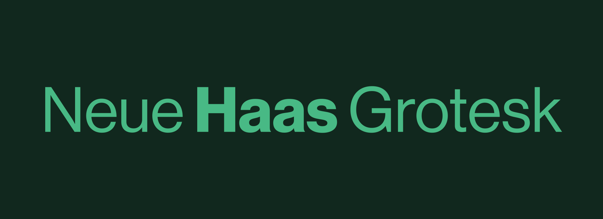 Der Text „Neue Haas Grotesk“ erscheint in Grün auf dunklem Hintergrund, wobei „Haas“ fett gedruckt ist.